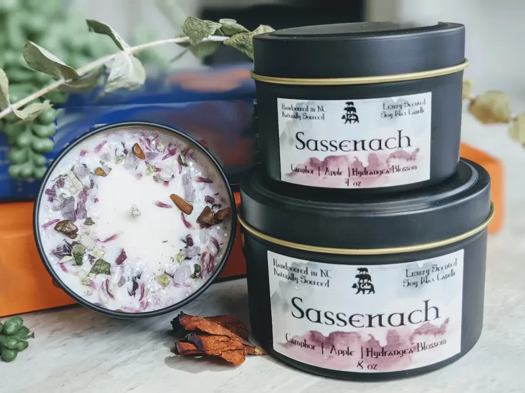 Sassenach candle with soft label design, handmade Outlander Etsy gift inspired by the Highlands.