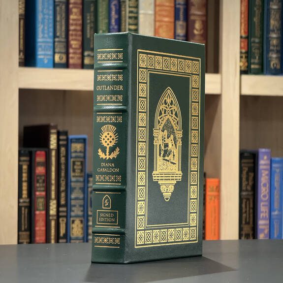 Leather-bound signed edition of Outlander by Diana Gabaldon, luxury collector’s gift for fans.